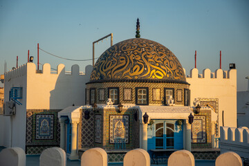 Gold calligraphy decorations on the dome of a building in Kairouan, Tunisia © Angela