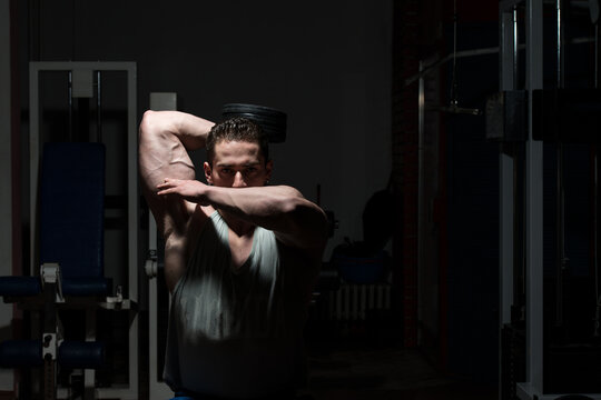 Muscular Men Doing Heavy Weight Exercise For Triceps