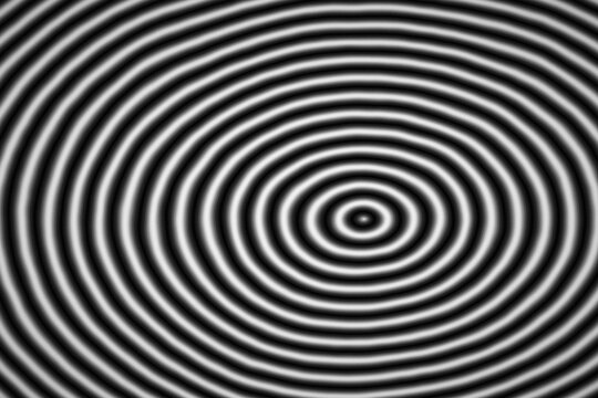 Concentric circles creating a black and white optical illusion, perfect for hypnotic designs
