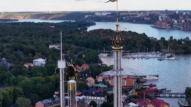 Close-up aerial of tower rides at Grona Lund in Stockholm, Sweden