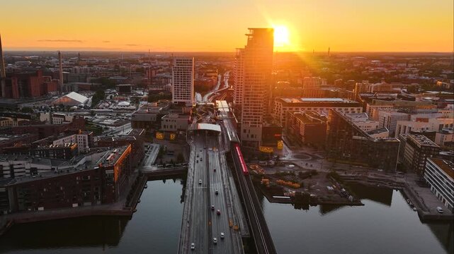 Aerial footage of Kalasatama district at sunset in Helsinki city, Finland