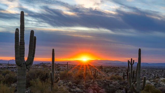Wide Ratio Sunset In North Scottsdale AZ With Glowing Sun Star on Horizon 