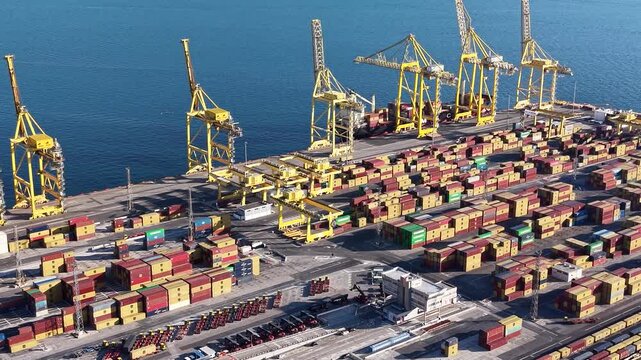 Flight over container shipping cranes in Trieste port, Italy