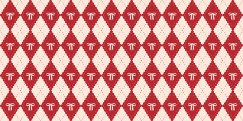 Obraz premium Coquette red argyle seamless pattern with bow. Cute harlequin rhombus background. Festive xmas print for textile, fabric and wrapping paper. Diamond shaped preppy pattern. Vector illustration