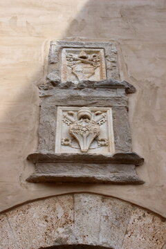 SPOLETO, ITALY - FEBRUARY 7, 2017: Stone coats of arms of Pope Alexander VI (top) and Pope Sixtus IV (bottom). Mounted on the historic fortifications (known as the "third gate") in Spoleto, Umbria