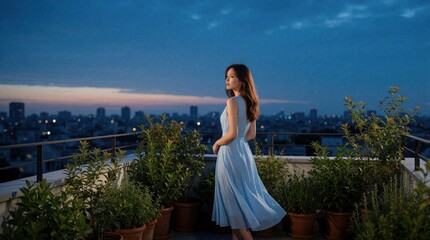 Obraz premium Young woman in light blue dress stands on urban balcony at dusk. Looks at city skyline during golden hour. Potted plants surround lady on quiet rooftop terrace. Calm evening atmosphere with twinkling