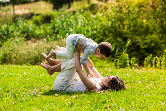 Mother and child playing outdoors creating family bond