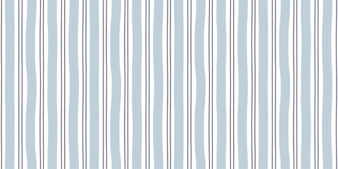 Fototapeta na wymiar Watercolor seamless pattern with irregular pastel blue stripes.Hand drawn vertical line background. Plaid repeat print for wrapping paper, textile, fabric and wallpaper. Vector illustration