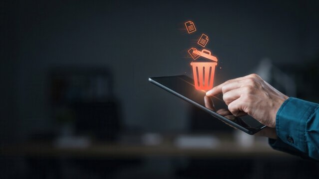 Digital user interface displays a glowing trash icon while deleting multiple electronic documents from a modern handheld touch screen tablet device