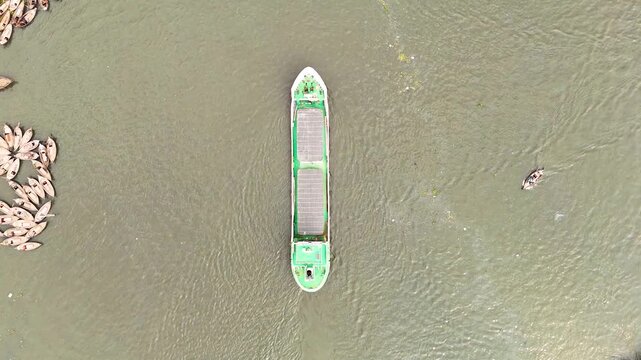 Aerial drone view of Sadarghat river port with passenger boats and dense Dhaka city