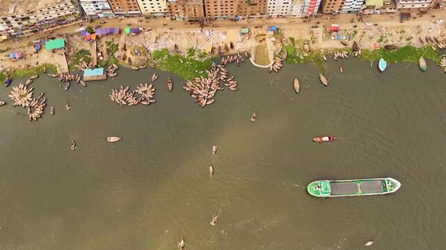 Aerial drone view of Sadarghat river port with passenger boats and dense Dhaka city