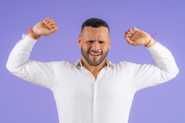 Fototapeta premium Young man expressing intense frustration and discomfort