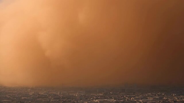 Dust Storm Creating Dramatic Golden Haze Over Urban Landscape at Sunset