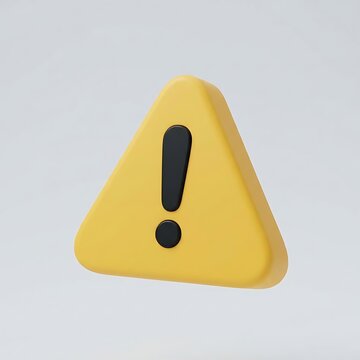 A yellow three-dimensional triangular warning sign with an exclamation mark sits on a.