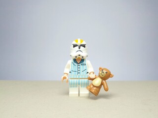 Fototapeta premium Indonesia - November 24, 2023 : Mini toy figure of lego at table with blurred background. Miniature photography concept design.