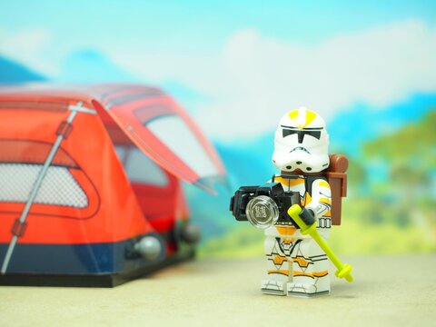 Indonesia - October 3, 2023 : Mini toy of action figure at table with blurred background. Travelling concept design.