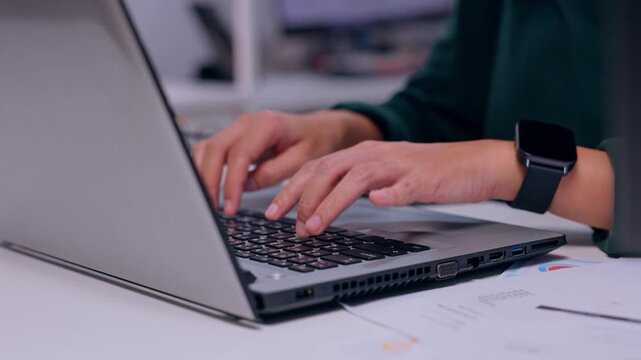 Person Typing on Laptop Keyboard in Office Workspace with Smartwatch Beside Paperwork, Computer Technology for Remote Business Work, Digital Office Equipment and Productive Desk Activity Closeup