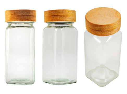 Isolated photo of glass flask, bottle or pepper shaker with wooden lid on white background.