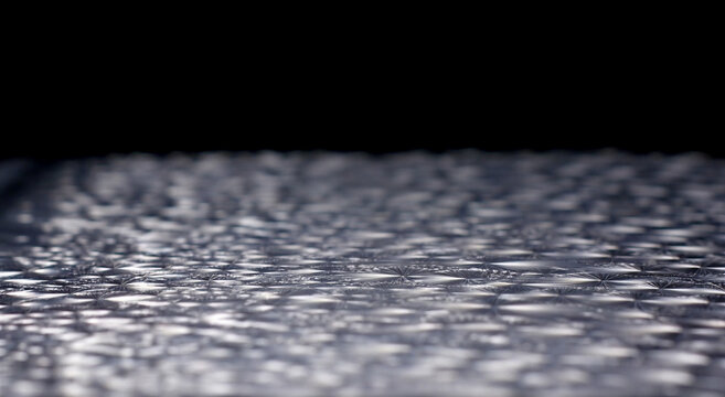 Abstract textured surface with light reflections