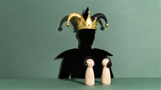 Jester shadow looms over two tiny figures with headphones, symbolizing hidden authority or surveillance.