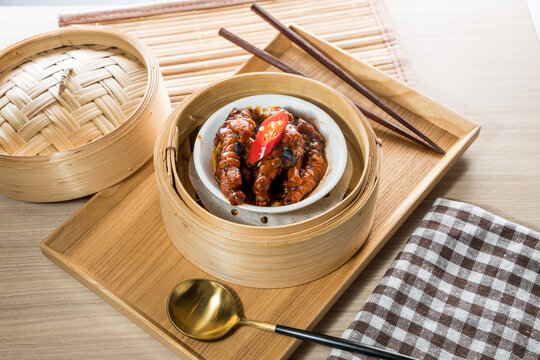 Dim sum chicken feet in bamboo steamer