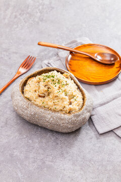 Creamy mushroom risotto in rustic bowl