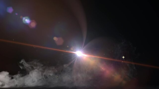 Lens flare shines intensely over a dark background with wispy white smoke creeping along the bottom edge.