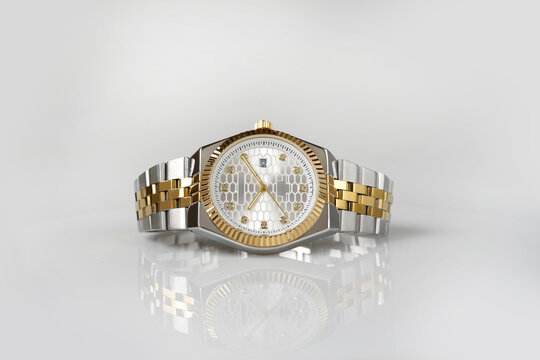 Luxury Two Tone Silver Gold Analog Wristwatch with White Dial and Metal Bracelet on White Background