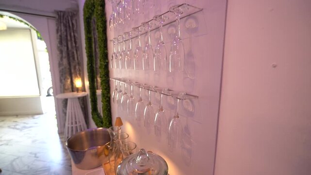 Glass drink dispenser glowing on a marble counter at a party