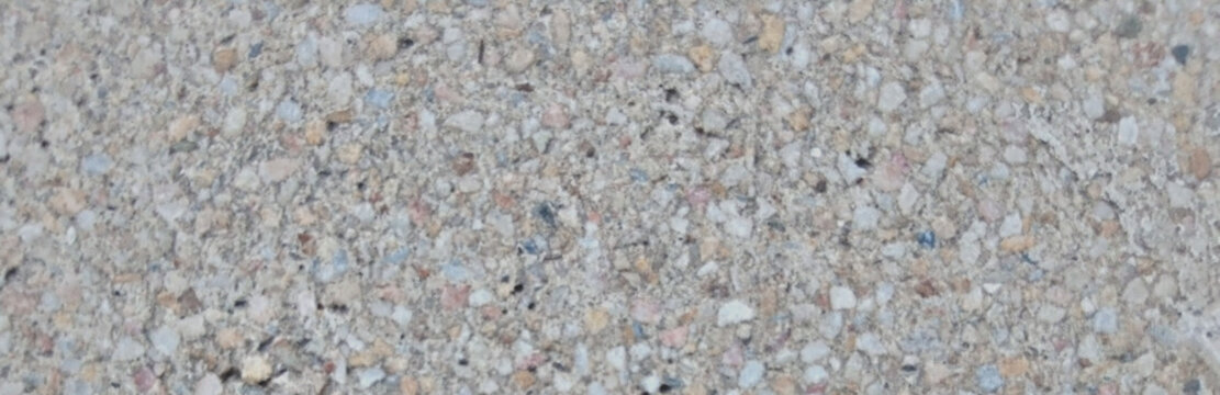 Exposed aggregate concrete texture, grey pebble wash finish for architectural design, rough stone cement surface for outdoor paving and construction