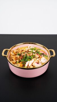 Traditional Indonesian Comfort Food Bubur Ayam with Shredded Chicken and Crackers