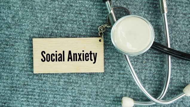 Stethoscope and paper tag with the word Social anxiety. an intense, ongoing fear of being watched, judged, or humiliated by other people in social situations