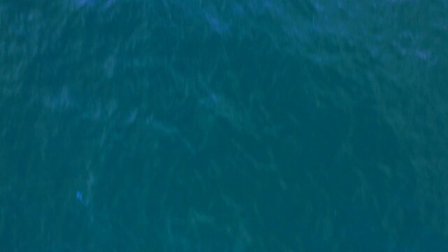 blue water surface background with sunset aereal shot drone on top