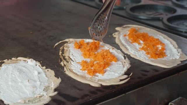 Cake mixed with yellow coconut in the street