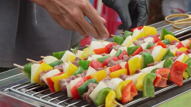 Colorful vegetable skewers being prepared for grilling