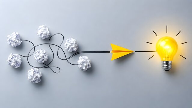 Yellow paper airplane flying from crumpled paper drafts to a glowing light bulb representing the creative process