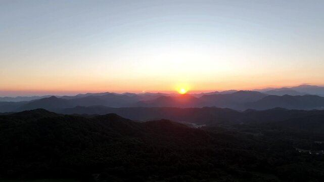 Sunrise over Mount Sanbe in Shimane, Japan, with the mountain glowing in warm morning light