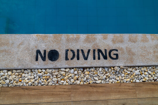 No Diving Sign Beside a Swimming Pool