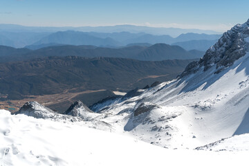 Jade Dragon Snow Mountain Overlooking Rolling Hills and Valley © TrinhVan