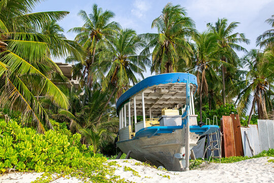 Traditional Maldivian Dhoni Boat On Tropical Beach