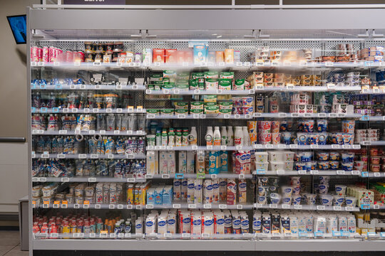 August 20, 2026, Amsterdam, Netherlands - Refrigerated display case stocked with dairy and plant-based products at Albert Heijn XL supermarket.