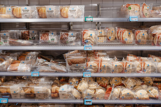 August 20, 2026, Amsterdam, Netherlands - Shelves stocked with various packaged bread products at an Albert Heijn supermarket