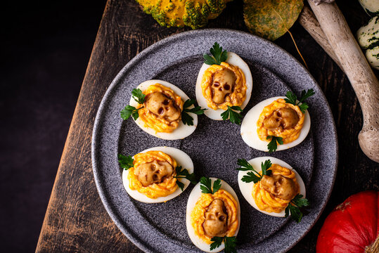 Deviled eggs decorated with skull Halloween food