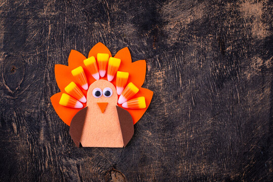Thanksgiving day background with craft handmade turkey