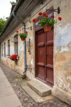 Flowering historic house facade in Kuldiga