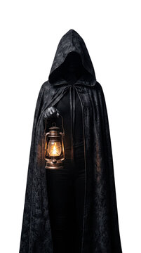 Mysterious figure wearing a black cloak holding a vintage lantern