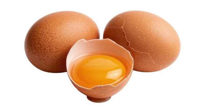 Two whole brown chicken eggs and one cracked egg with bright yellow yolk, isolated on transparent background
