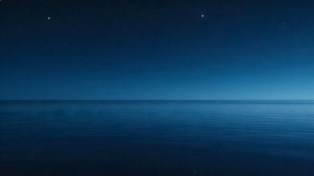 Calm dark blue ocean under starry night sky