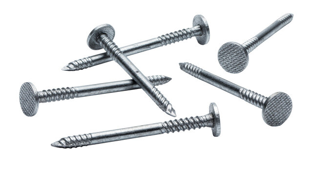 Several metallic screw nails with textured heads, isolated on transparent background
