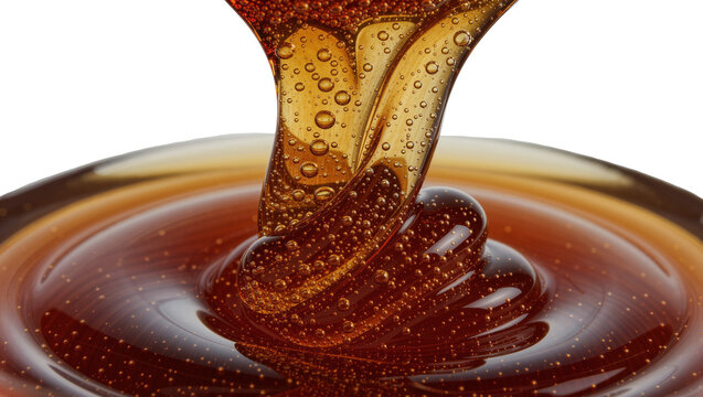 Viscous amber syrup with air bubbles flowing into a pool, isolated on transparent background